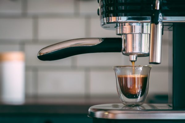 selective-focus-shot-espresso-machine-making-tasty-warm-coffee-morning_181624-8504